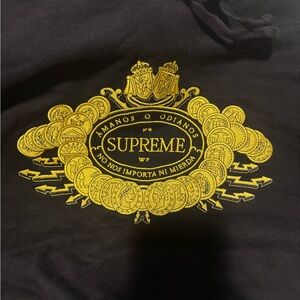 Supreme Black “Gold Coin” Hoodie with Subtle Logo